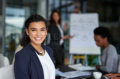 Buy stock photo Portrait of an attractive young businesswoman sitting in the boardroom during a meeting