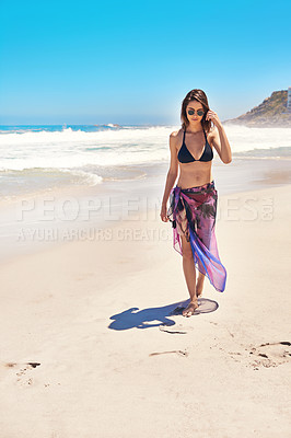 Buy stock photo Shot of a sexy young woman walking on the beach