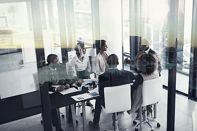 Buy stock photo Shot of a corporate business meeting superimposed over a cityscape