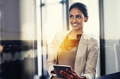 Buy stock photo Shot of an attractive young businesswoman superimposed over a cityscape