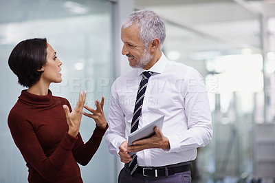 Buy stock photo Discussion, mentor and business woman with tablet in workplace for feedback, review or communication. Synergy, manager and female worker with technology for support, consult or advice in office