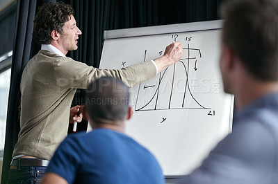 Buy stock photo Man, presentation and writing on chart, board and group of business people at financial workshop. Presenter, ceo and pen for graph, coaching or brainstorming for finance, stock and progress at job