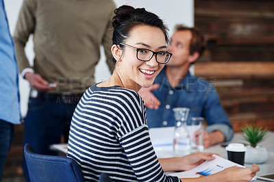 Buy stock photo Portrait, creative and woman with smile, desk and meeting with group, teamwork and planning for project. Design, agency and employee with happiness, career and table for document, together and office