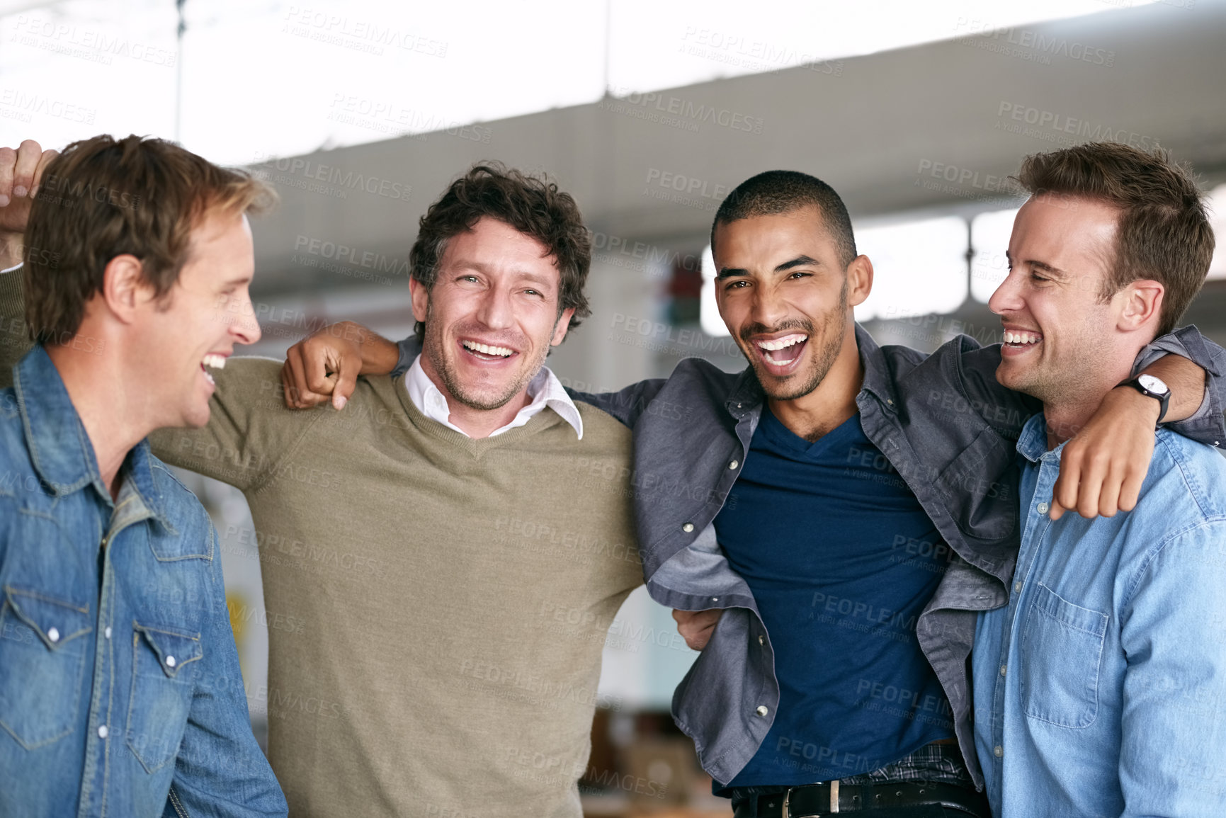 Buy stock photo Shot of a group of male coworkers cheering together in a modern office