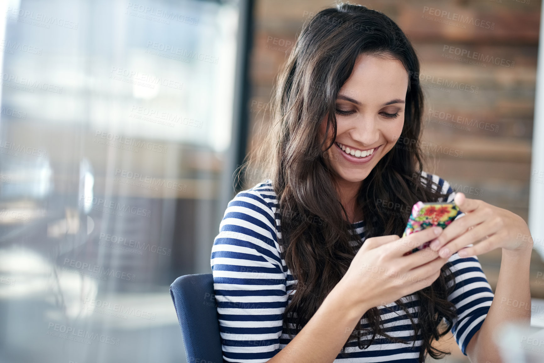 Buy stock photo Happy woman, office and typing with phone for communication, social media or connection. Young female person or employee with smile on mobile smartphone for online chatting or texting at workplace