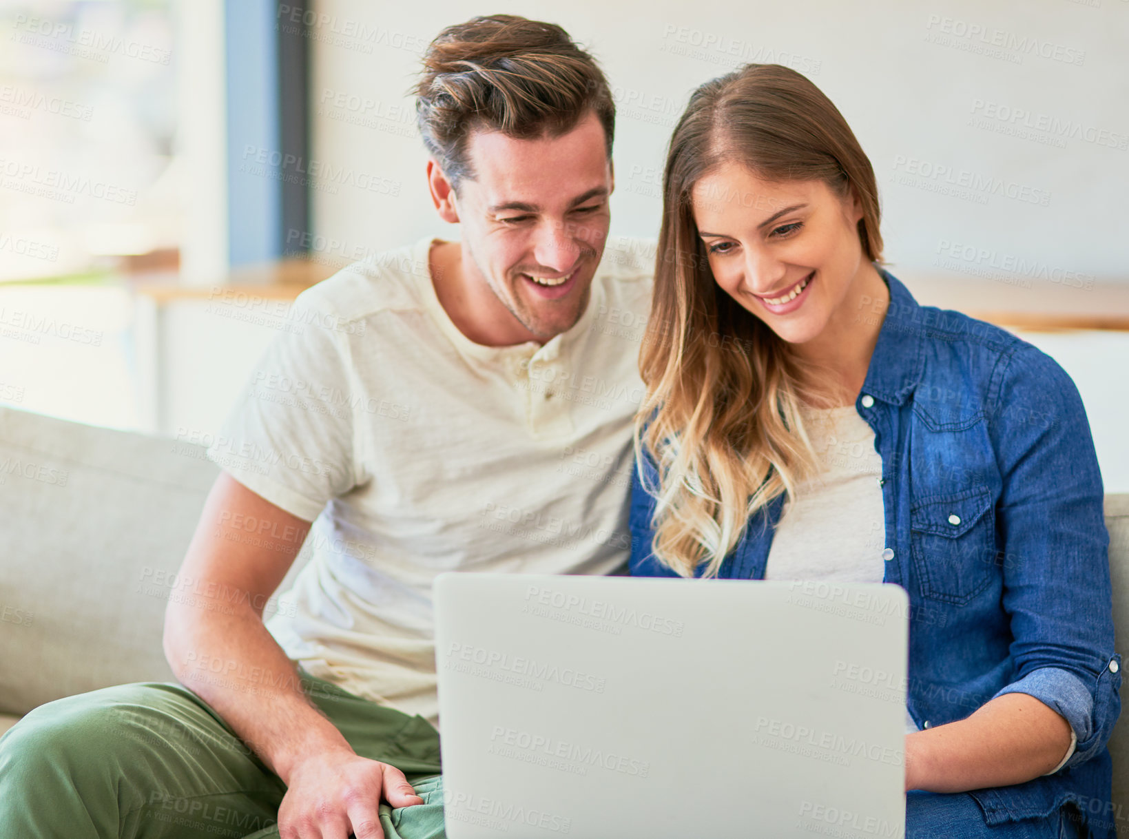 Buy stock photo Couple, sofa and online on laptop with happiness for approved application on rental confirmation for new apartment. Man, woman and together in home with internet for streaming comedy shows and movie.