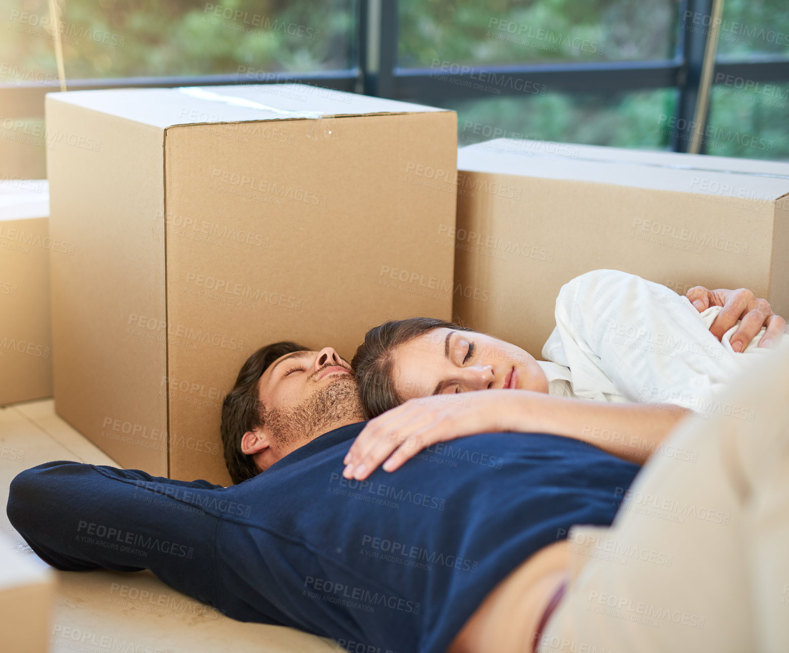 Buy stock photo Couple, sleeping and moving in new home with box on floor for property, apartment or building. Tired man and woman asleep in relaxation for house investment, rest or break with boxes in living room