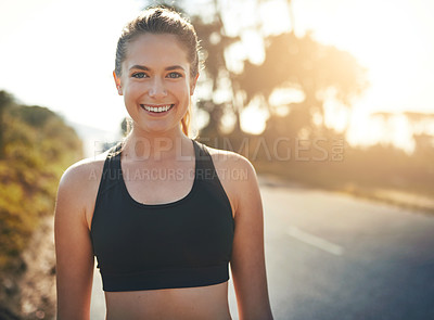 Buy stock photo Shot of a young runner training outdoors