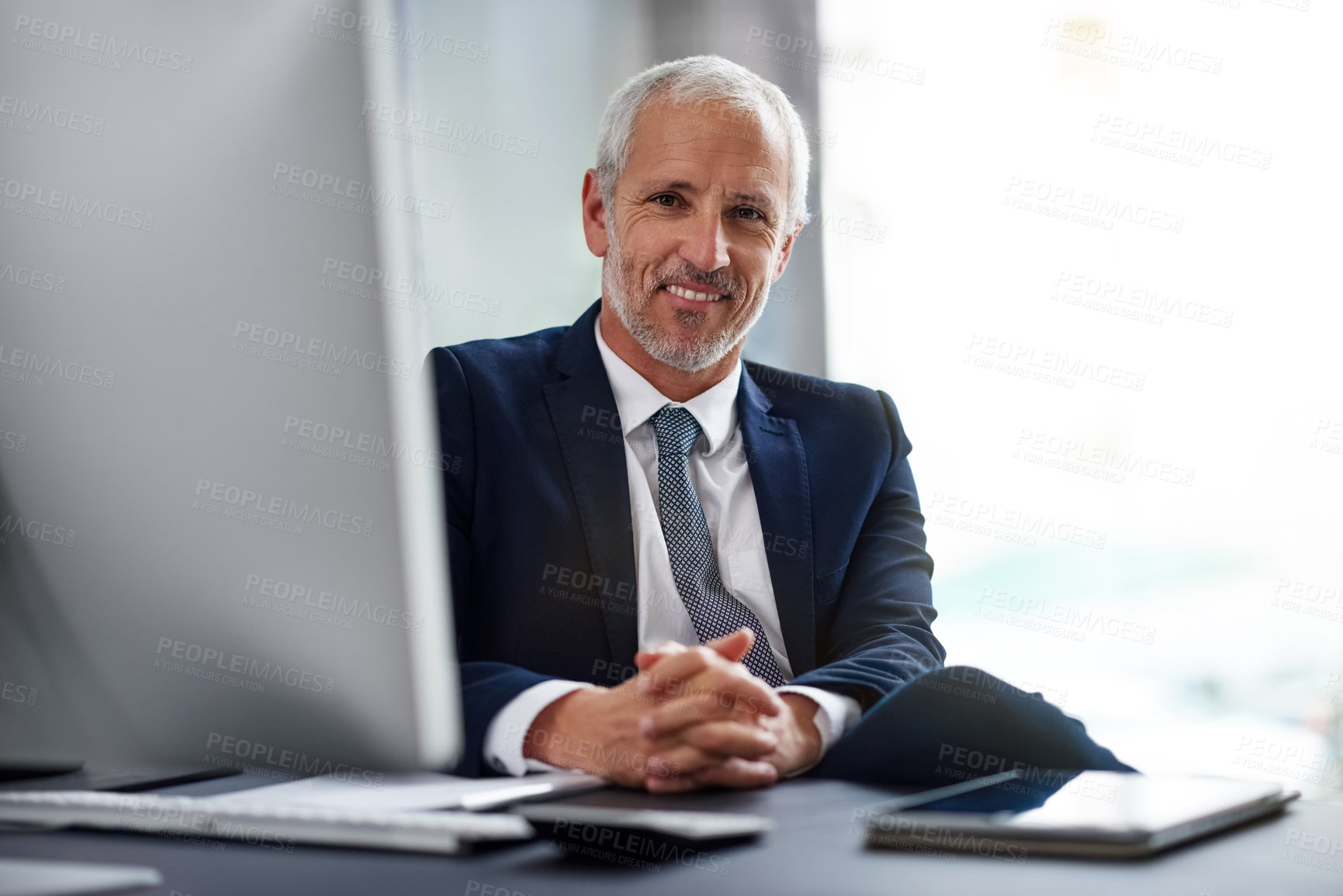 Buy stock photo Portrait, office and smile for businessman, desk and computer for CEO in workplace. Technology, portrait and calm male person or senior management, corporate and finance advisor for investment broker