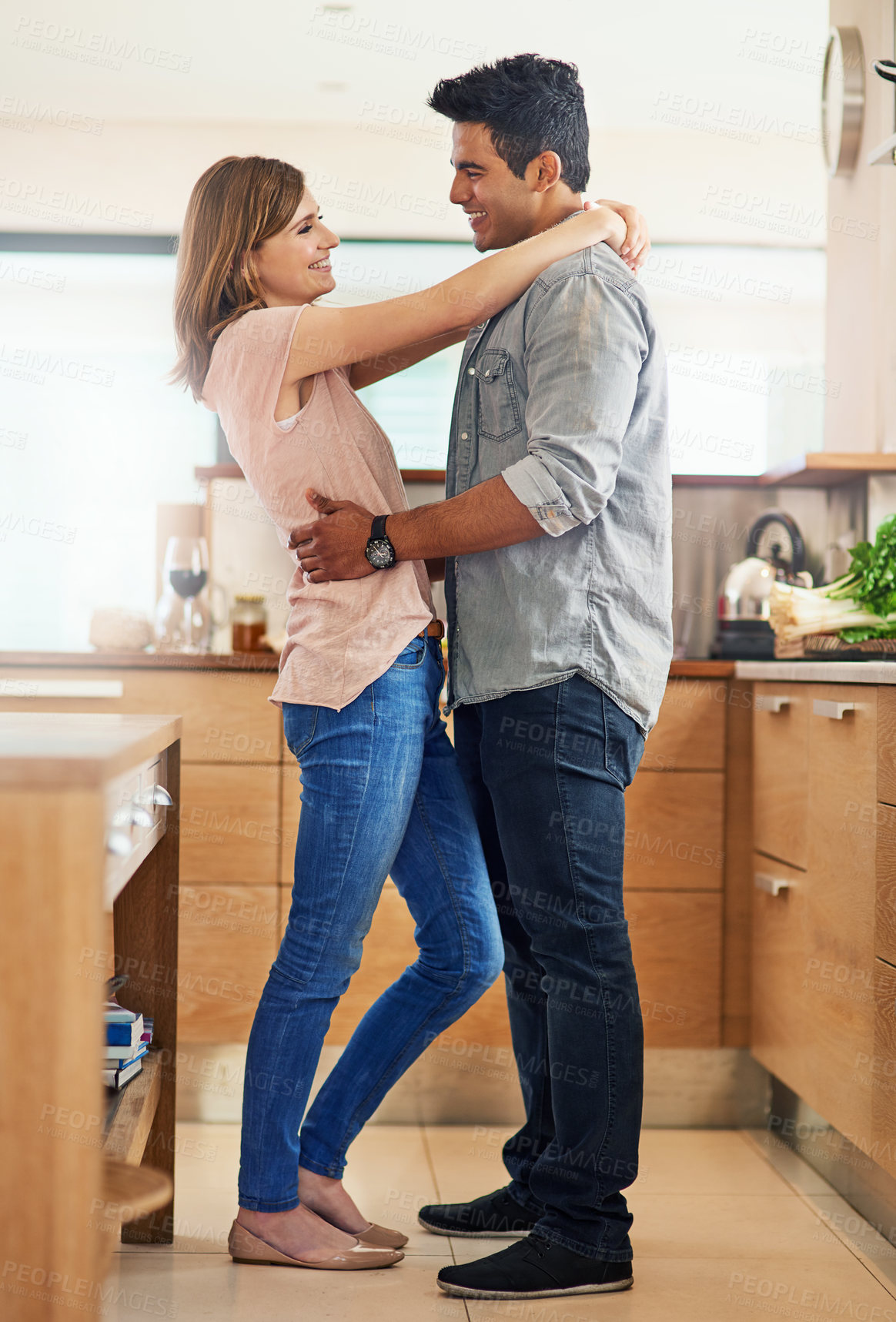 Buy stock photo Couple, people and happy with hug in kitchen to relax for bonding, love and support on break together. Home, relationship and romance with smile or laugh for fun, enjoy and care with soulmate