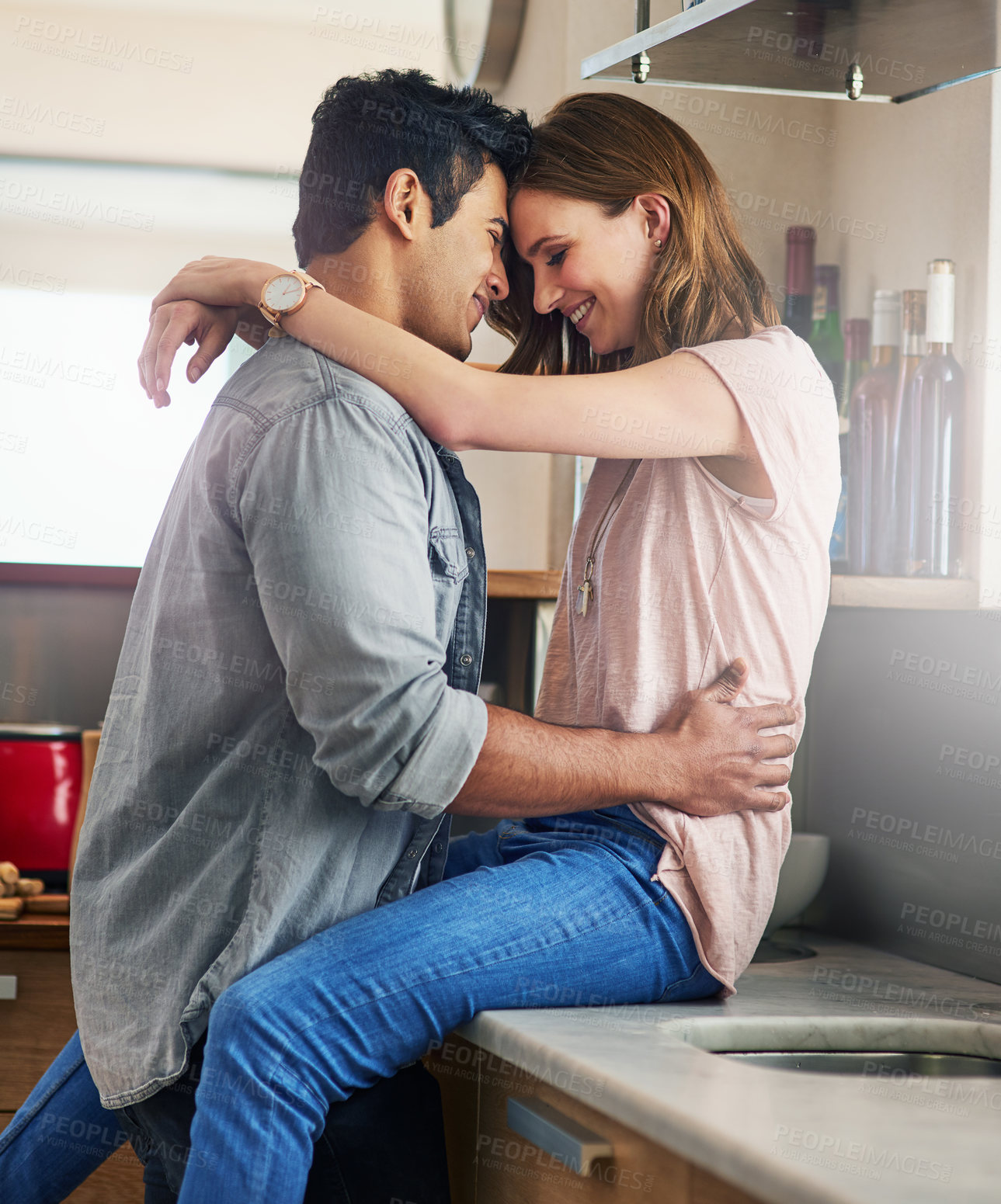 Buy stock photo Couple, people and happy in kitchen counter with forehead touch to relax for bonding, love and support. Home, relationship and romance with smile or affection for fun, enjoy and care on break