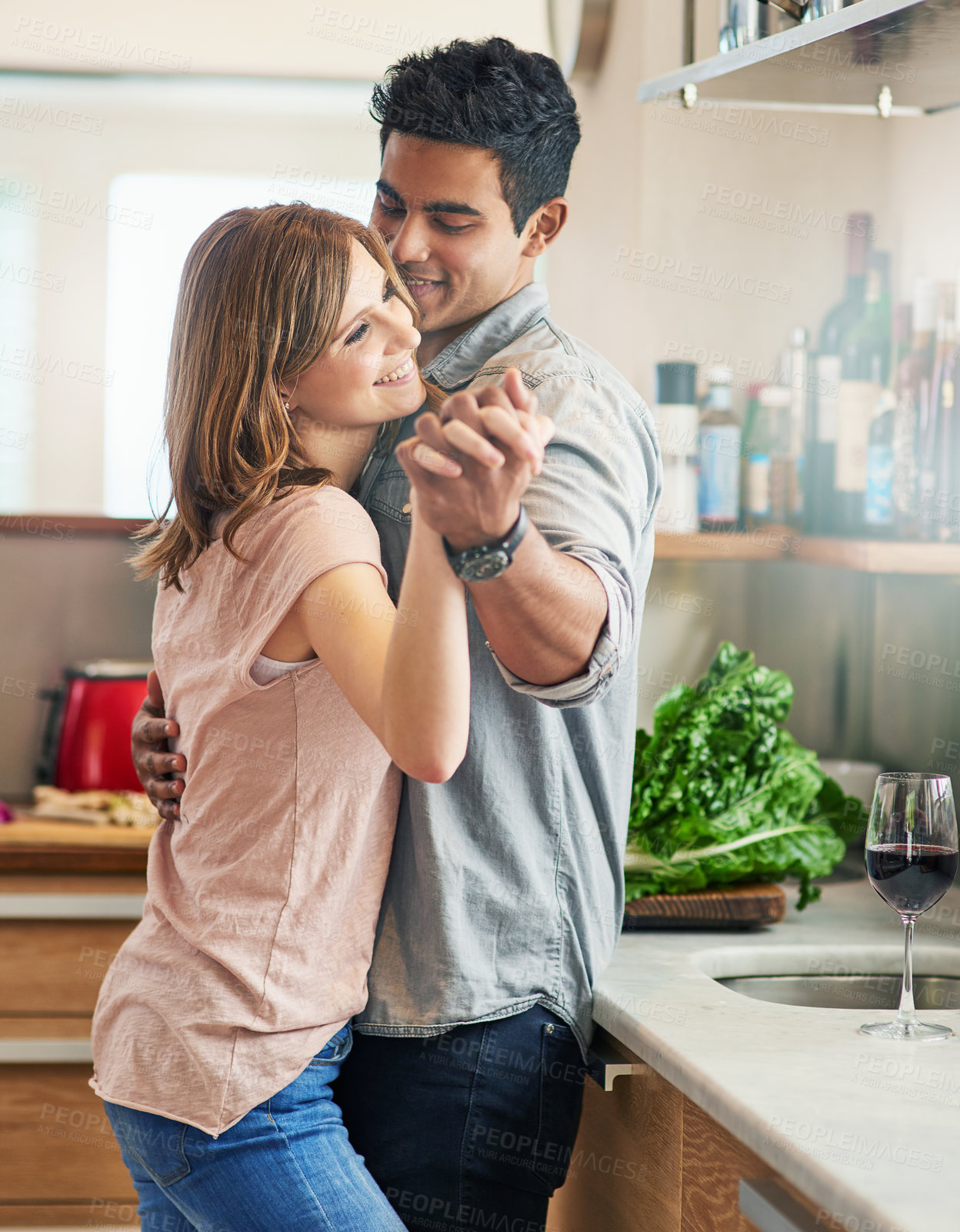 Buy stock photo Couple, people and happy with dancing in kitchen to relax for bonding, love and support on break together. Home, relationship and romance with smile or laugh for fun, enjoy and care as soulmate