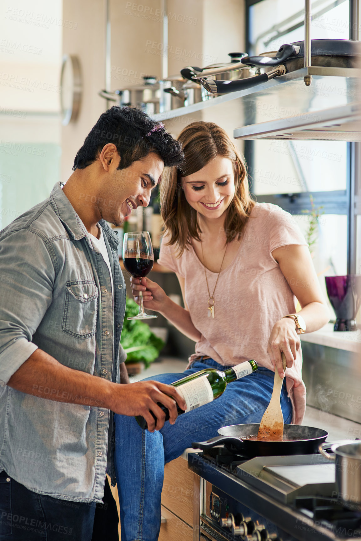 Buy stock photo Man, woman and wine for cooking, together and eating with relationship and love in kitchen. Couple, home and food for play, diner or supper with romance and recipe for date and relaxation in house