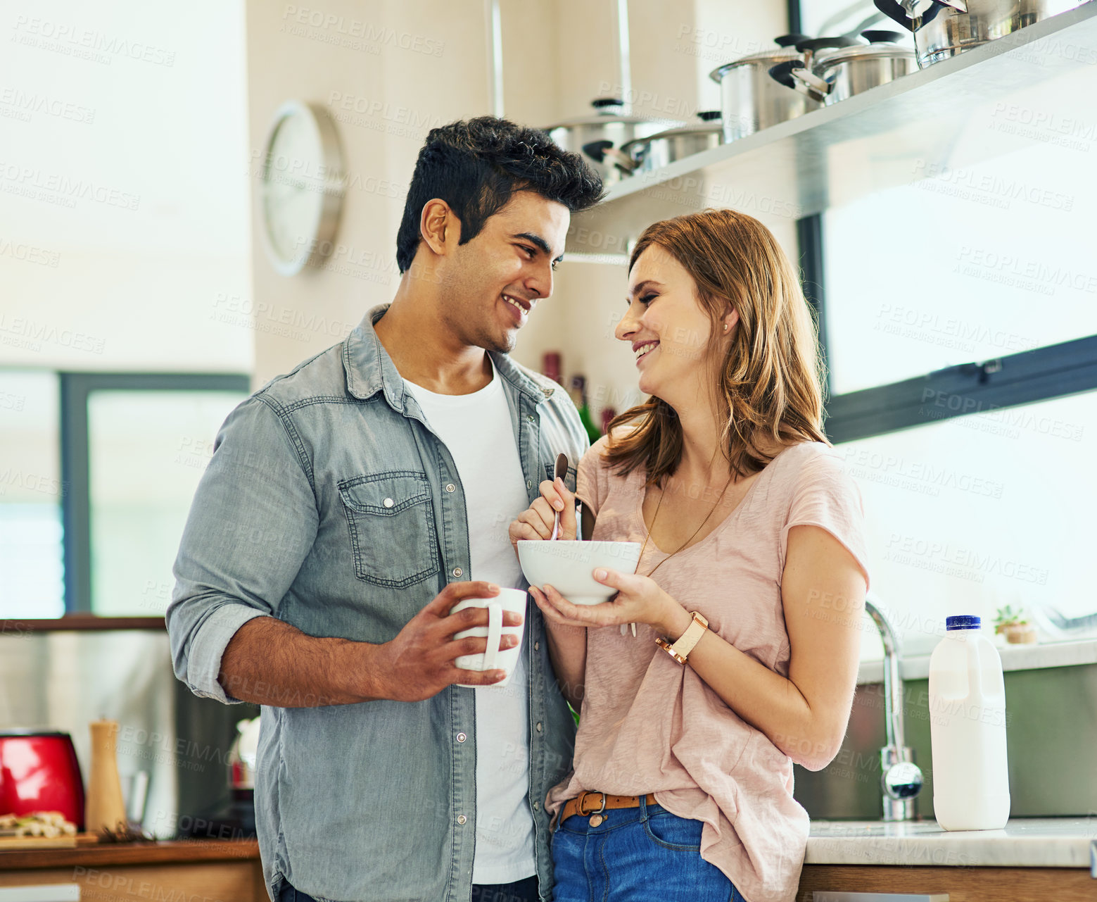 Buy stock photo Couple, breakfast and love in house with hug for relationship, date and time together in living room. Man, woman and support with happiness, tea and smile in home for connection, care and commitment