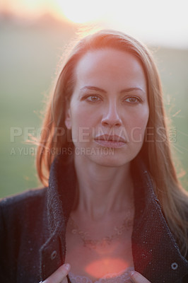 Buy stock photo Cropped shot of an attractive woman posing outside