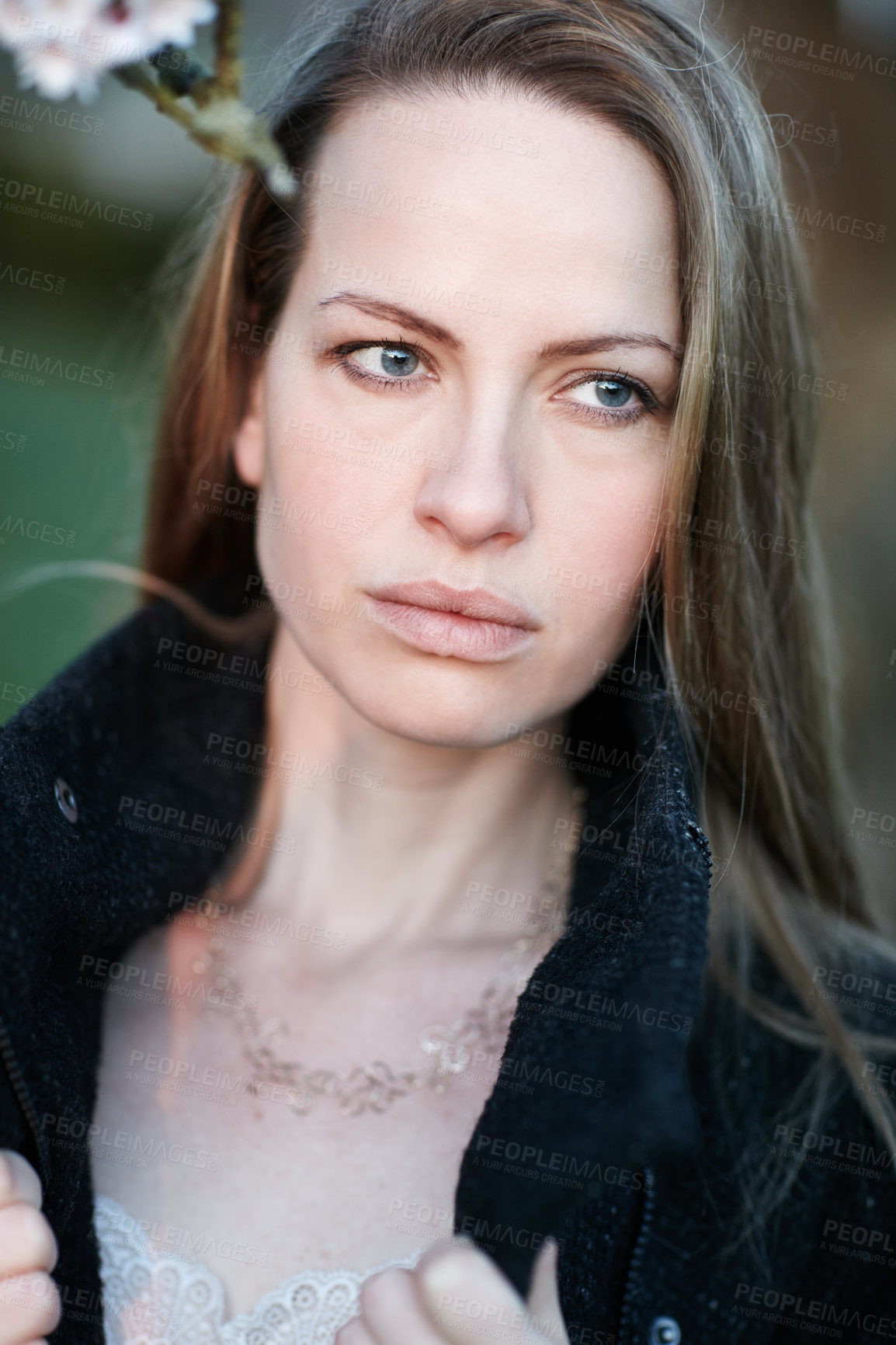 Buy stock photo Cropped shot of an attractive woman posing outside