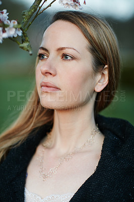 Buy stock photo Cropped shot of an attractive woman posing outside