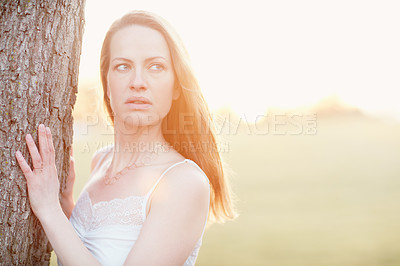 Buy stock photo Cropped shot of an attractive woman posing outside