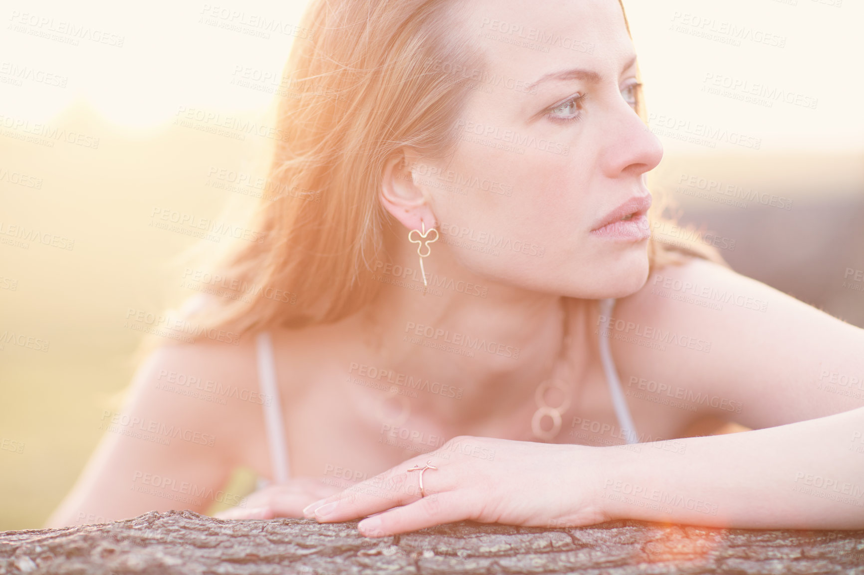 Buy stock photo Cropped shot of an attractive woman posing outside