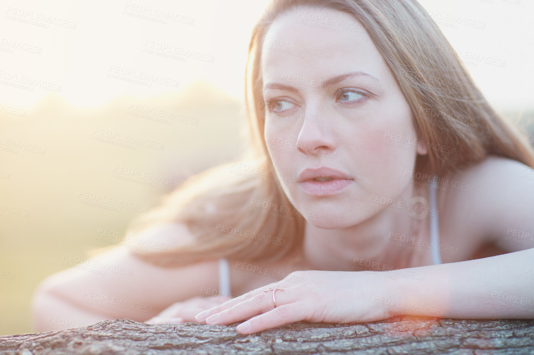 Buy stock photo Cropped shot of an attractive woman posing outside