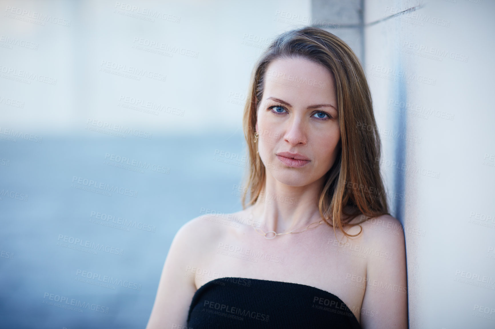 Buy stock photo Cropped portrait of an attractive woman posing outside