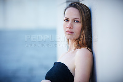 Buy stock photo Cropped portrait of an attractive woman posing outside