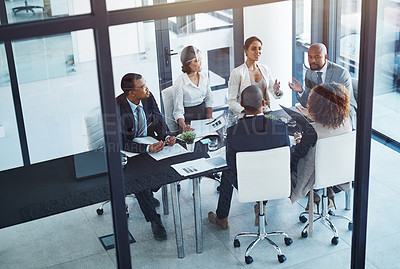 Buy stock photo Conversation, business people and team in a meeting for discussion, brainstorming or planning in office. Teamwork, group and corporate colleagues working on a project together in workplace boardroom.