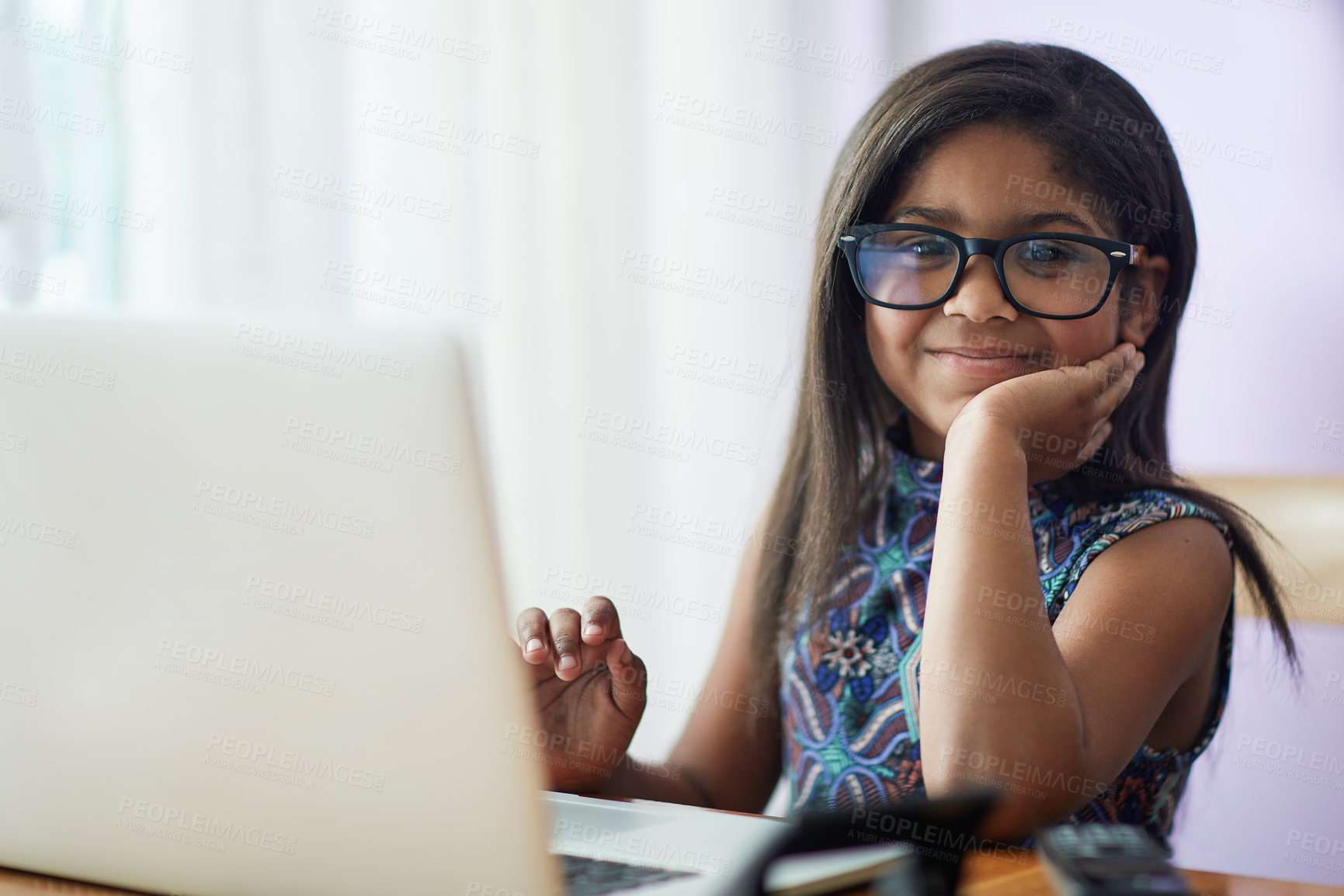 Buy stock photo Portrait of a cute little girl using a laptop in her bedroom at home