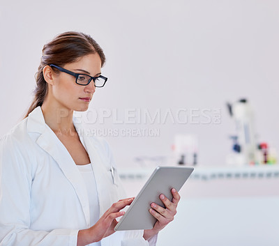 Buy stock photo Tablet, woman and scientist reading in laboratory with medical research for covid vaccine. Discovery, professional and female virus researcher with digital technology for pharmaceutical innovation.