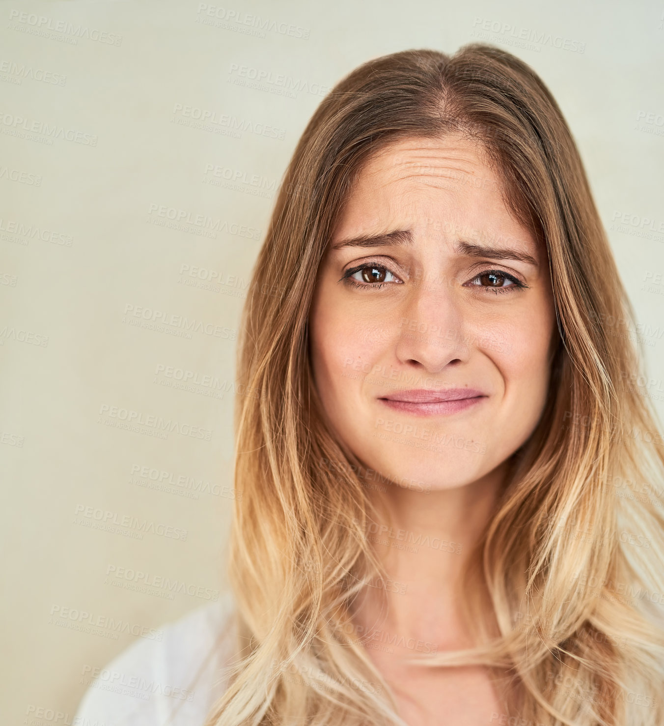 Buy stock photo Portrait of a young woman making a face in studio