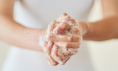 Buy stock photo Closeup shot of a woman washing her hands with soap