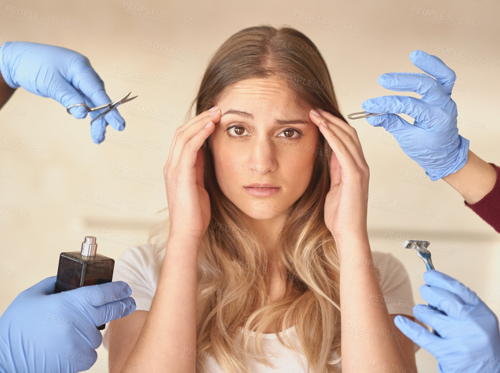 Buy stock photo Portrait of an anxious young woman surrounded by hands holding grooming products