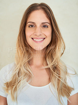 Buy stock photo Portrait of an attractive young woman smiling in studio