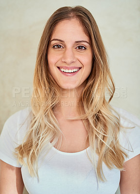 Buy stock photo Portrait of an attractive young woman smiling in studio