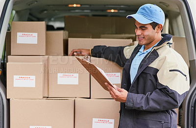 Buy stock photo Cropped shot of a delivery man standing next to a van full of boxes