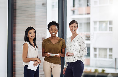 Buy stock photo Cropped portrait of a group of businesswomen standing together in a modern office