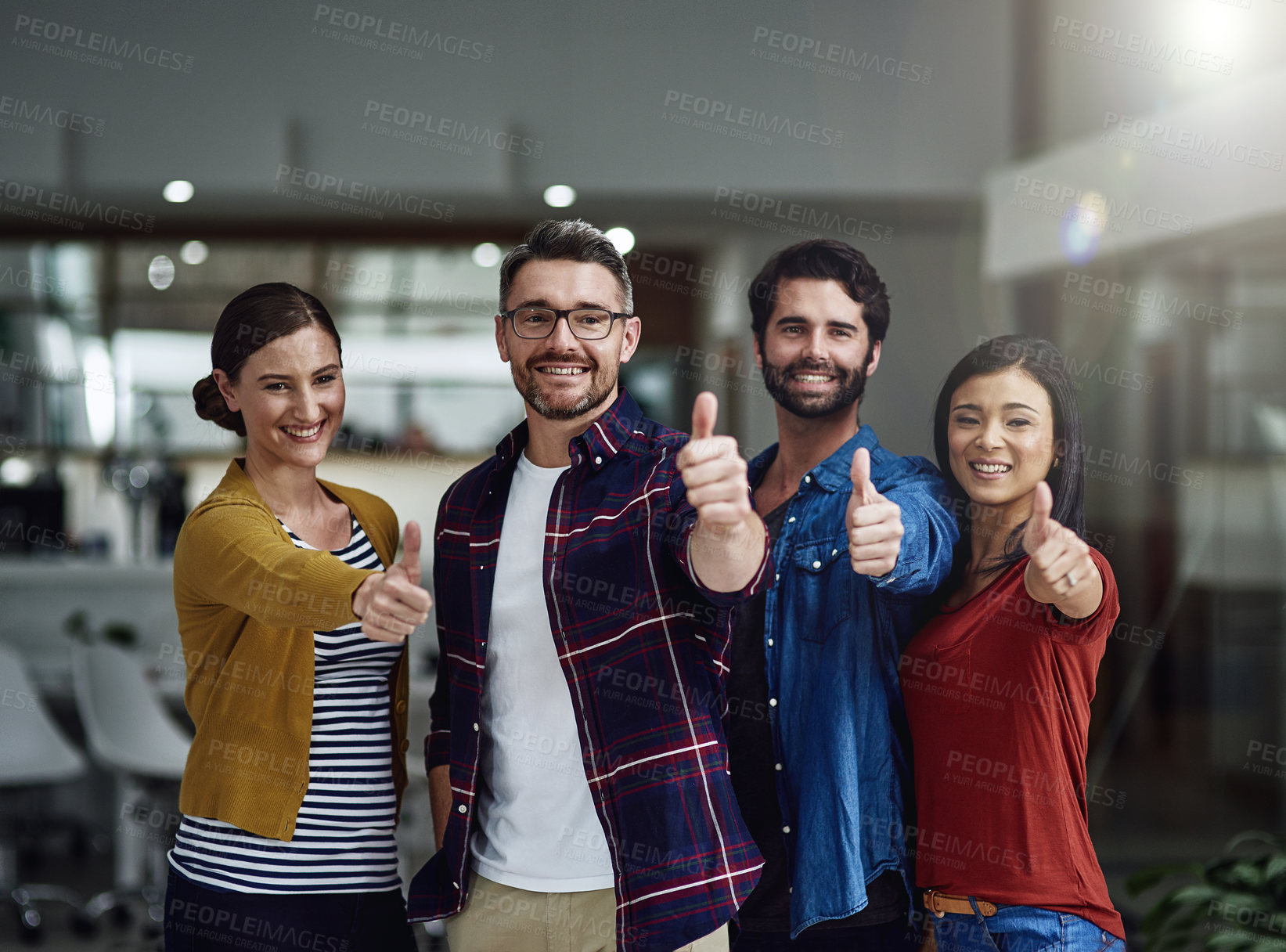 Buy stock photo Portrait of a group of businesspeople showing thumbs up