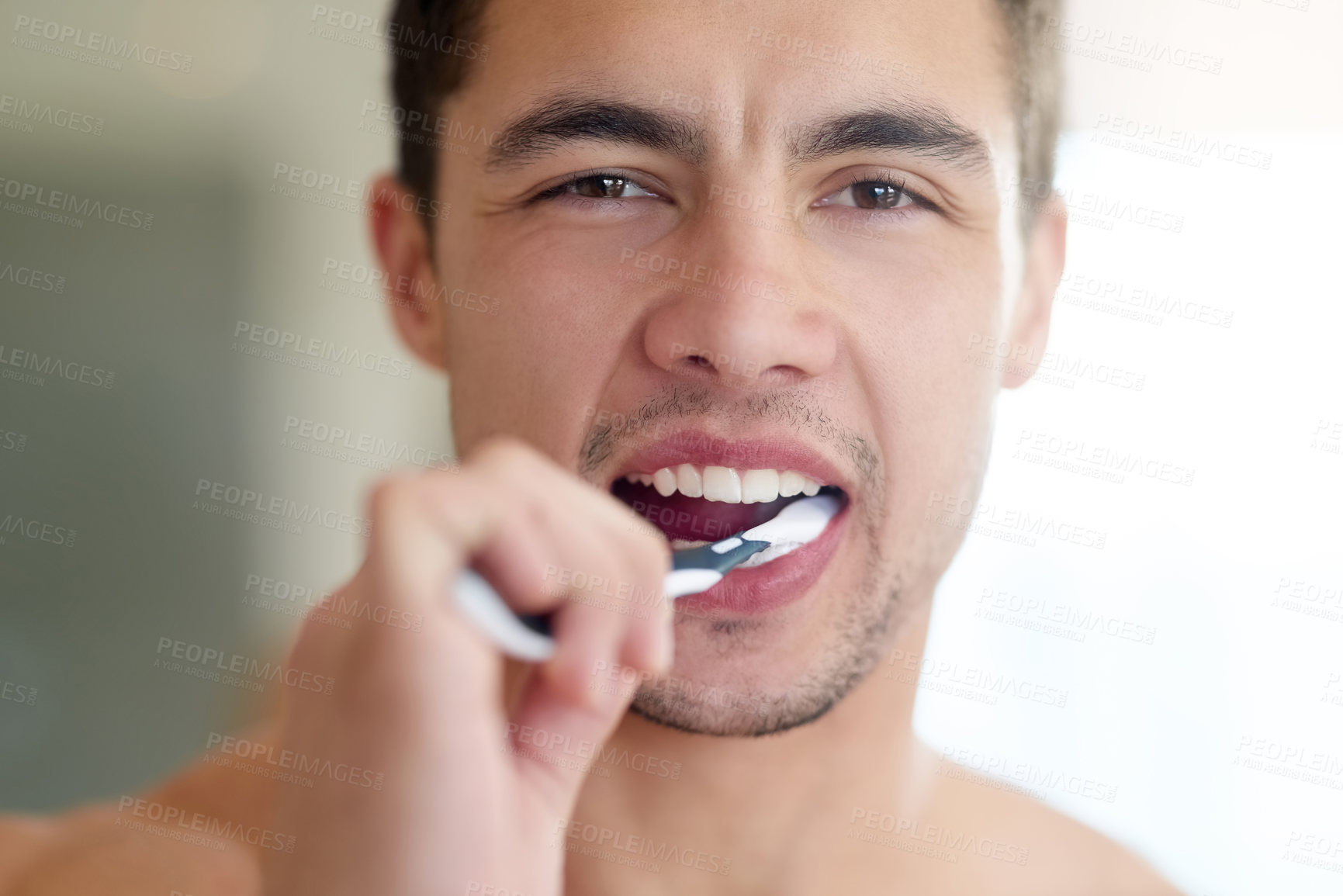 Buy stock photo Dental care, portrait and man brushing teeth with mouth in bathroom for hygiene, cleaning or wellness at home. Male person, toothbrush or prepare in morning for routine, breath or selfcare or health