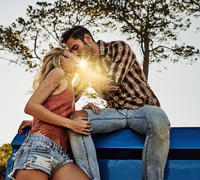 Buy stock photo Shot of an affectionate couple spending the day outdoors