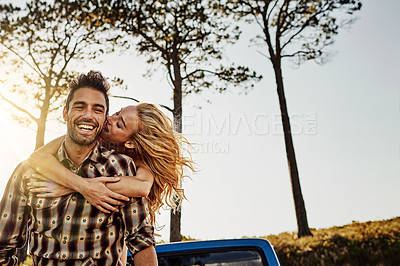 Buy stock photo Shot of an affectionate couple spending the day outdoors