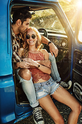 Buy stock photo Shot of a young couple out on a road trip with their truck