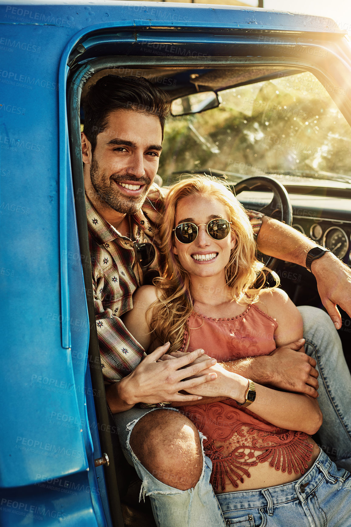 Buy stock photo Shot of a young couple out on a road trip with their truck