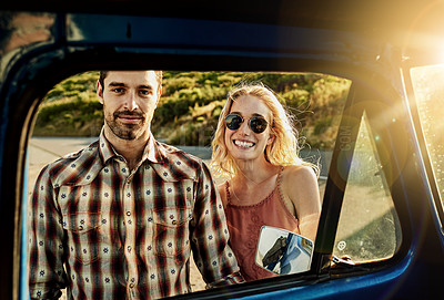 Buy stock photo Shot of a couple couple standing by the window of a pickup truck