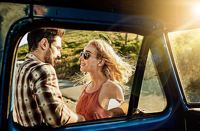 Buy stock photo Cropped shot of a young couple outside a pickup truck