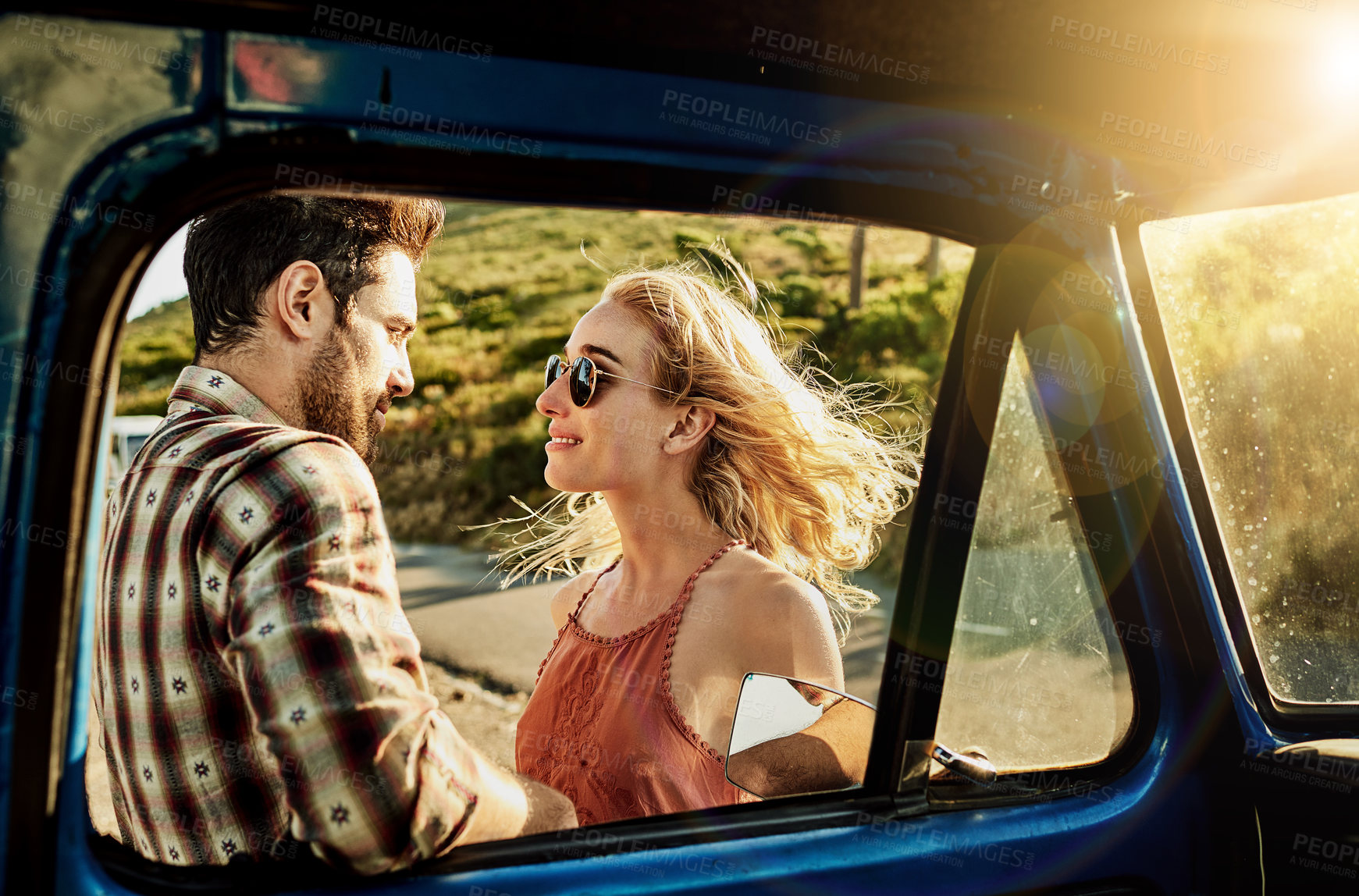 Buy stock photo Cropped shot of a young couple outside a pickup truck