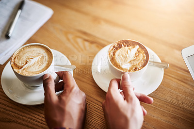 Buy stock photo Shot of two unidentifiable men having coffee in a coffee shop