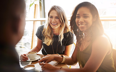 Buy stock photo Shot of a group of friends catching up over coffee in a coffee shop