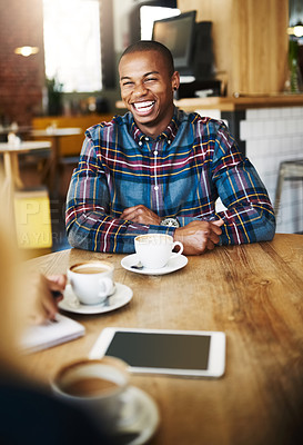 Buy stock photo Black man, coffee shop and laugh for funny, conversation and drink on breakfast break in morning. Male person, restaurant and talk with friend, smile and comfort for weekend, relax and peace in cafe