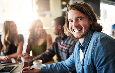 Buy stock photo Portrait of a man having coffee with friends in a coffee shop