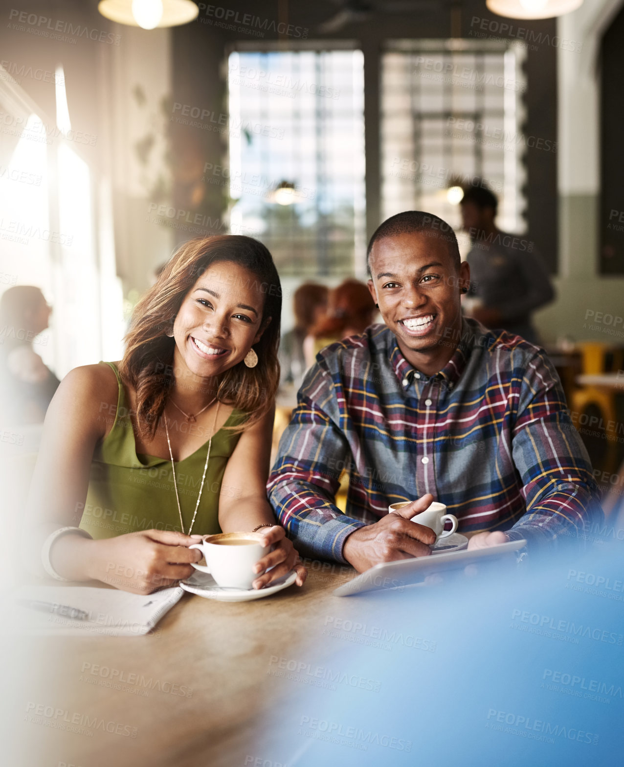 Buy stock photo Shot of a couple enjoying a double date with friends in a coffee shop